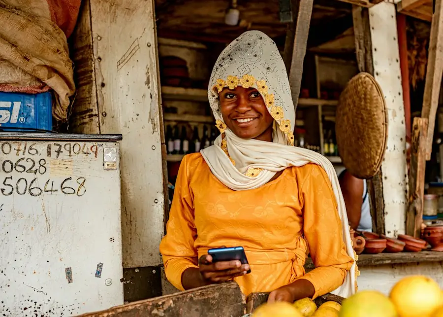 A shop owner using a mobile phone at her counter